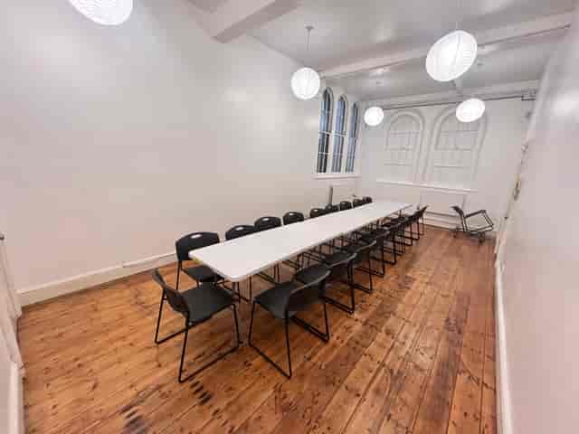 Main hall at Clapton Park URC with high ceilings, ideal for affordable meeting or event space hire.