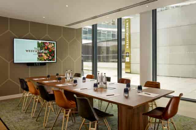 Modern boardroom at The Astrea, Hotel Riu Plaza London, ideal for executive meetings and events.