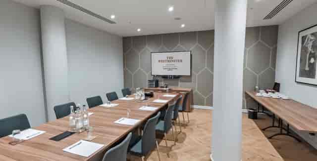 Modern boardroom at The Astrea, Hotel Riu Plaza London with catering space for business meetings.