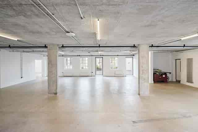 Industrial-chic event space with concrete pillars for art installations and pop-up showrooms.