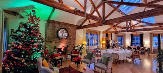 Christmas corporate dinner at Shoreditch Loft with exposed brick, ideal for holiday networking.