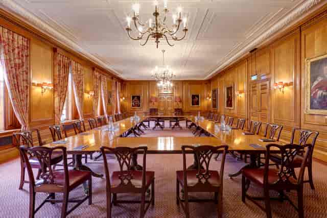 U-shaped boardroom table in historic Inner Temple Parliament Chamber for executive meetings.
