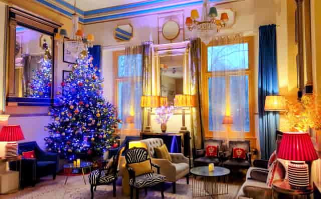Christmas boutique event lounge at The Embassy, Lumiere London with warm festive decor.