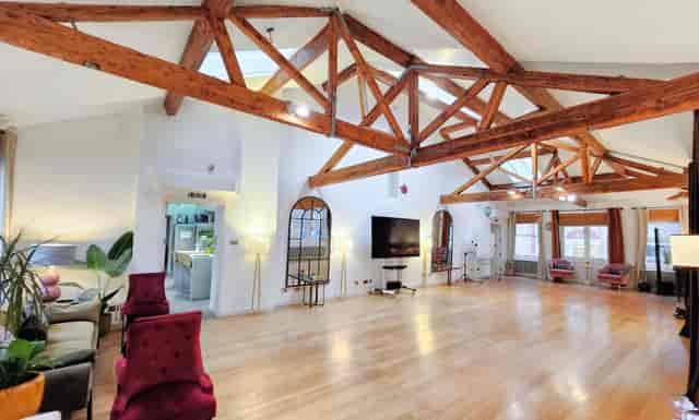 Shoreditch Loft event venue with rustic timber beams for corporate workshops and networking.