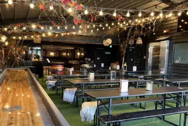 Banyard Room outdoor space with string lights for networking and social events at The Tivoli.