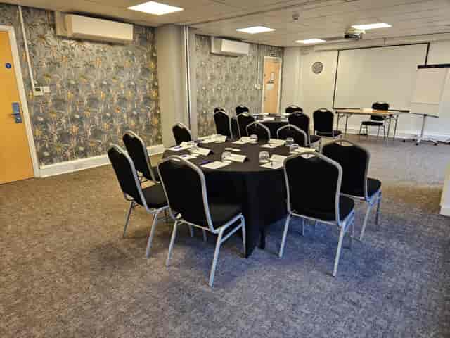 Portland Arms main venue with round tables, perfect for intimate workshops and corporate events.