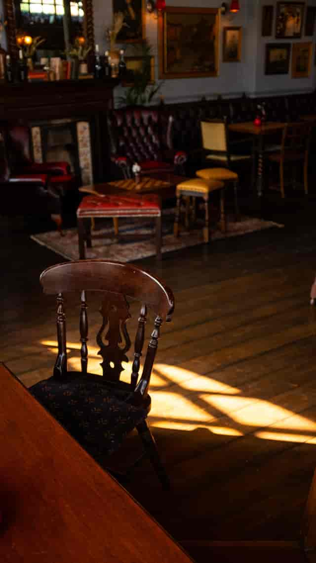 Main Pub lounge with vintage furniture for small-group networking and brainstorming sessions.