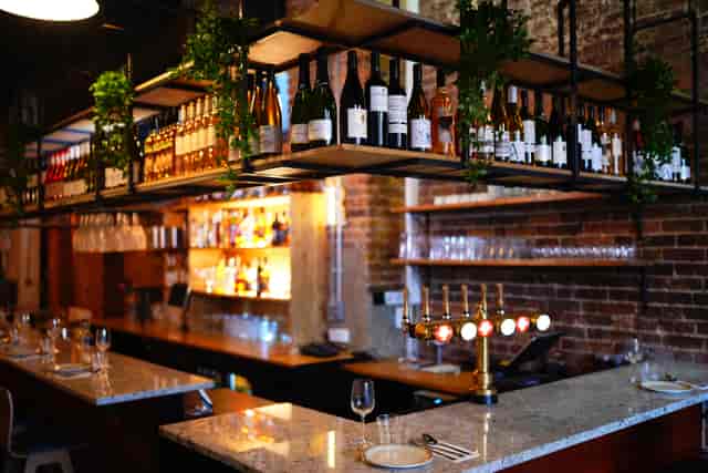 Private downstairs bar at Rao's: Industrial-chic space for networking mixers and receptions.