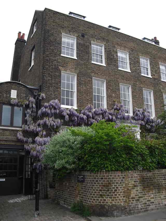 The Coach House venue featuring historic charm and wisteria, perfect for intimate spring events.
