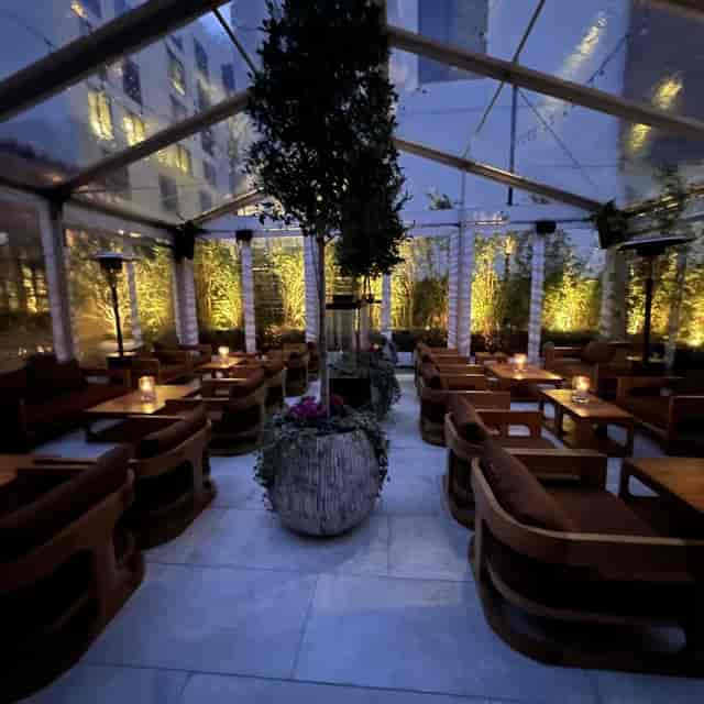 Upscale clear-span tent at The Conservatory for VIP networking and luxury reception events.