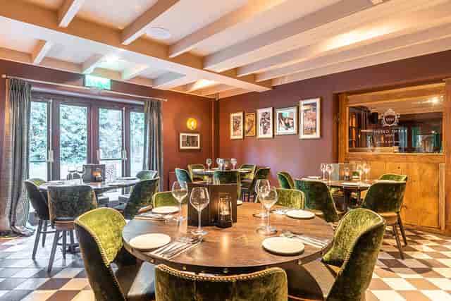 Private dining room at The Barnt Green Inn with velvet seating for VIP dinners and networking.
