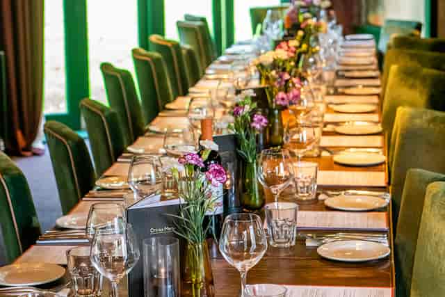 Private dining room at The Barnt Green Inn with velvet seating for corporate dinners and events.