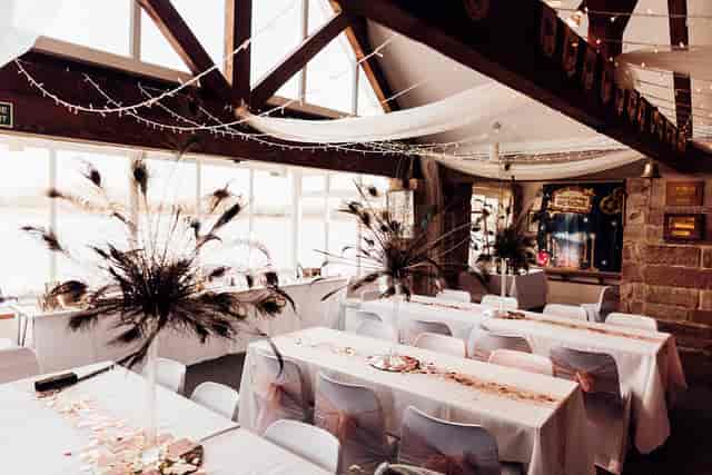 Private Dining Room banquet setup with ostrich-feather centerpieces for formal event venue hire.