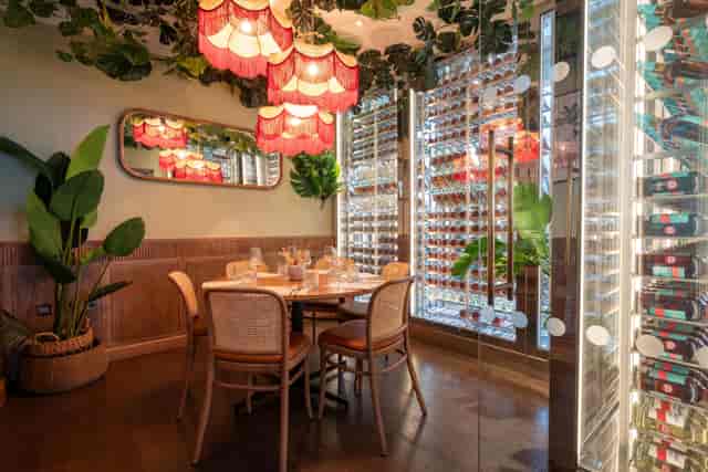 Private dining room with wine display for executive business dinners and corporate events.