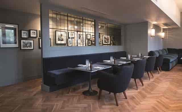 Main Restaurant VIP networking dinner venue with sophisticated banquette seating.