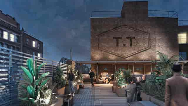 Industrial-chic rooftop terrace venue with brick walls for networking receptions.