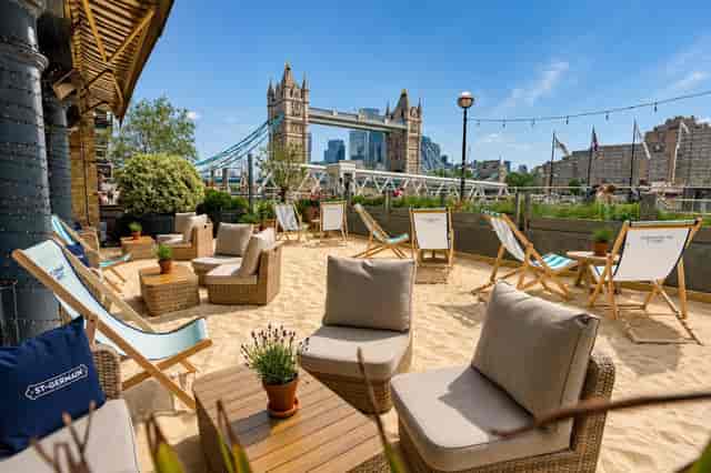 Le Petit Coin pop-up at Le Pont de la Tour featuring iconic waterfront branding for event hire.