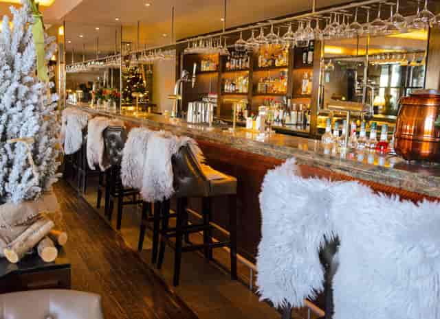 Le Petit Coin luxury bar with faux-fur decor for corporate events and holiday mixers.