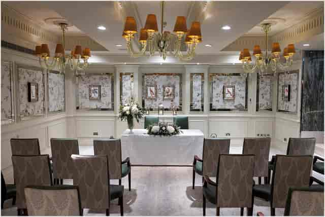 Elegant Garden Room at The Goring with crystal chandeliers for boutique weddings and meetings.