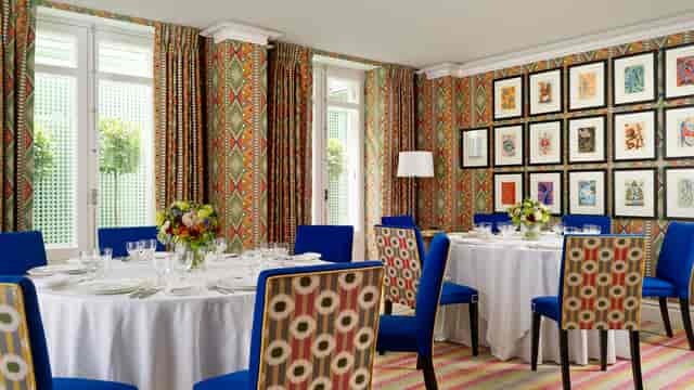 Fortune & Lyric Rooms: Intimate round table setup for board dinners and networking events.