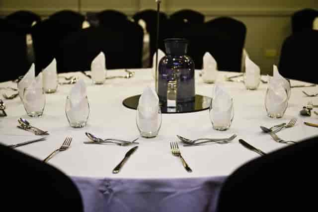 Gala banquet setup in Village Hotel Reading Inspiration suite with formal place settings.