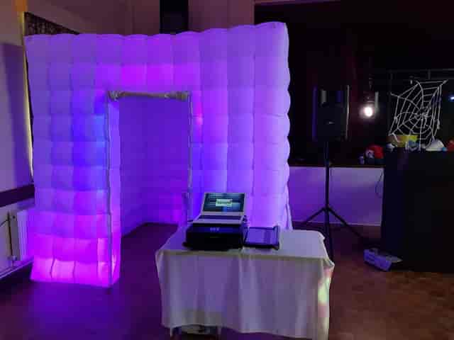 LED-lit inflatable photo booth in St Matthew's Church Hall for corporate parties and events.