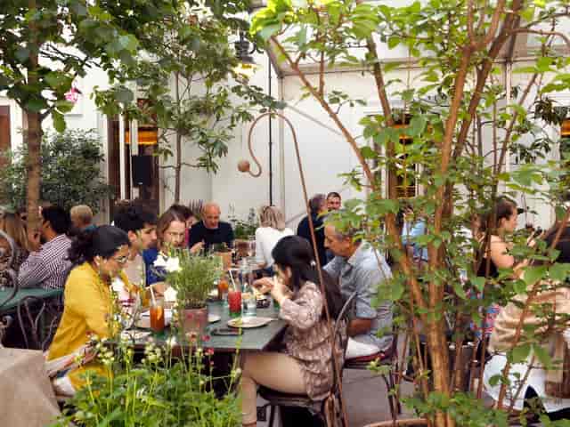 Al fresco networking dinner at The Olden Garden courtyard venue.