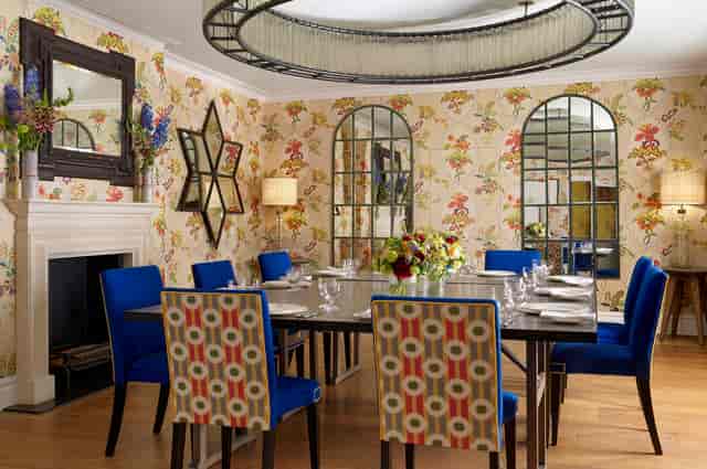 Fortune Room private dining space with bold blue seating for executive meetings and events.