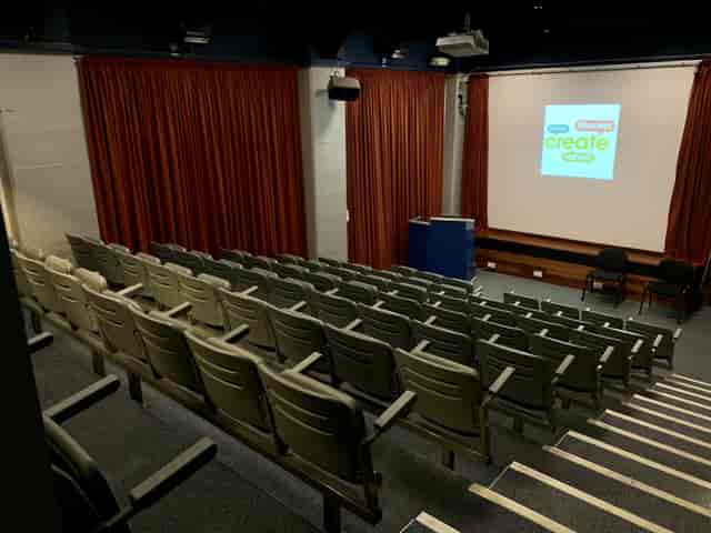 Tiered theatre auditorium for corporate presentations and workshop events.