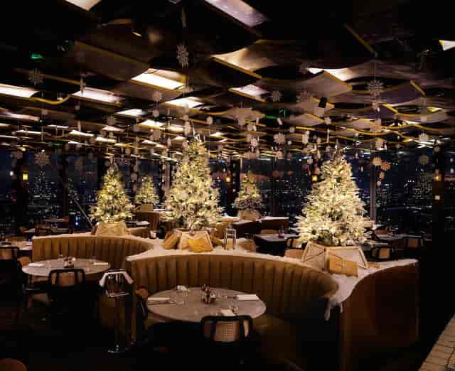 Full venue hire at The Cardinal Bar with festive decor and panoramic city views for holiday events.