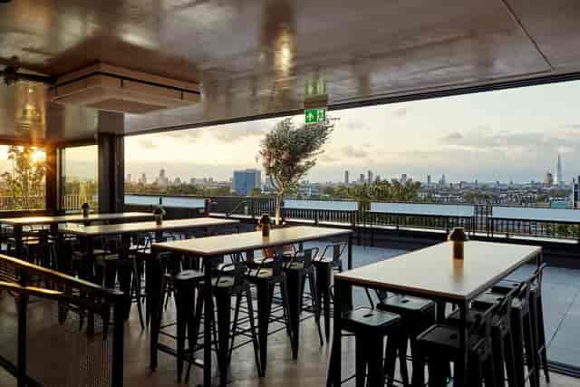 Covered rooftop terrace at Forza Wine with city views for corporate networking and mixers.