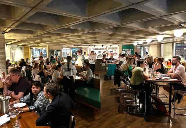 Forza Wine heated terrace hosting a networking event with a high-density seating layout.