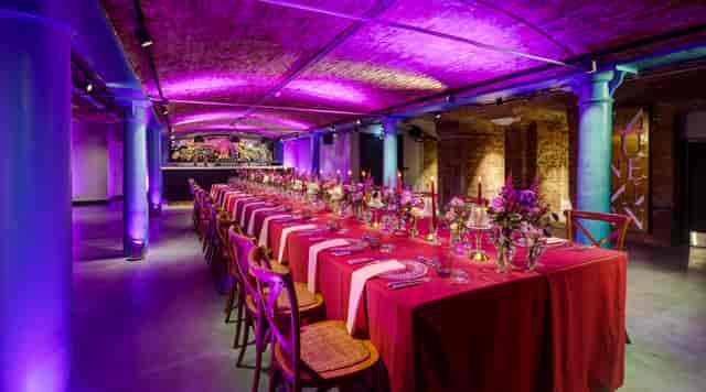 Historic Vaults banquet setup with purple lighting for luxury event venue rental.