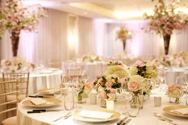 Elegant gala setup at Ripley Arts Centre with floral centerpieces for luxury weddings and events.