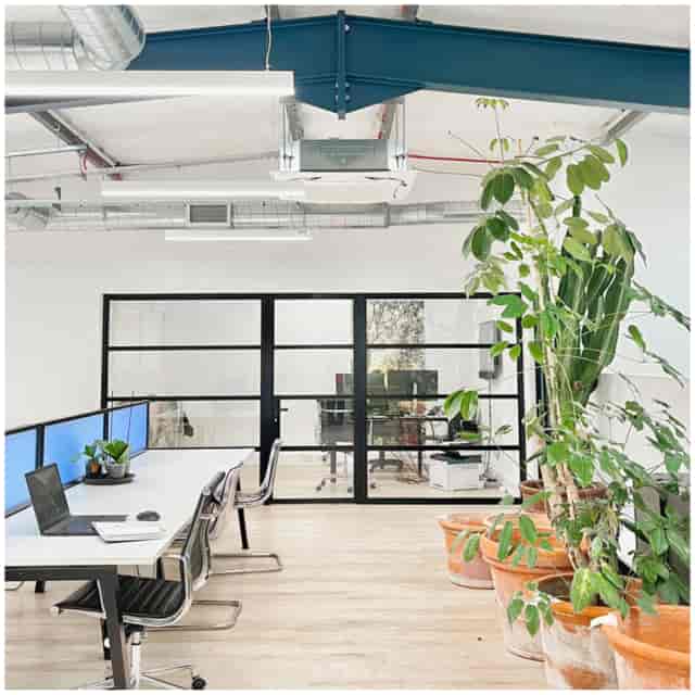 Modern industrial-chic studio for team meetings and project planning.