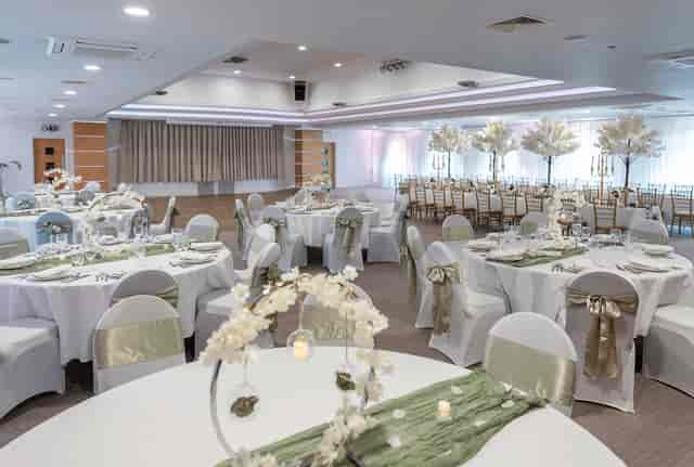 Main Hall wedding banquet with floral centerpieces, elegant table setup for event venue.