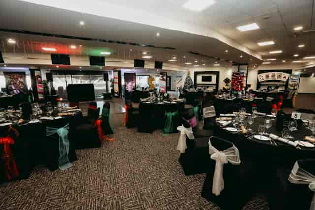 Clubhouse banquet setup with black linens for eclectic wedding or party event venue in Mitcham.