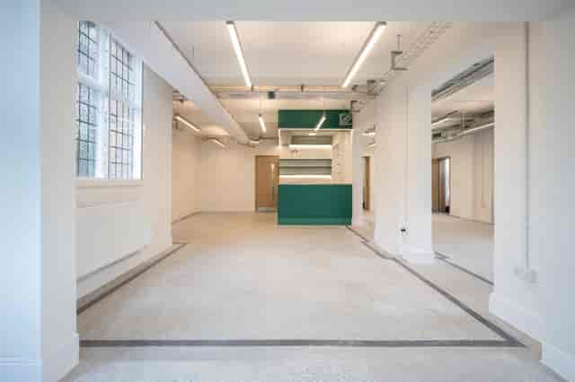 Community Main Hall venue with built-in bar for corporate events and product showcases.