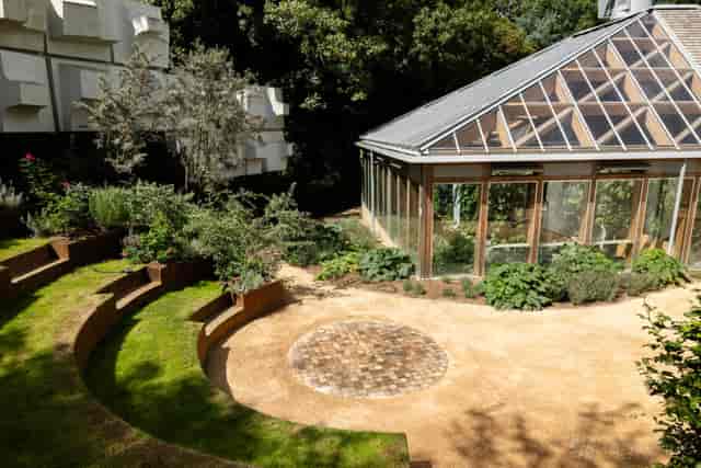 Paper Garden outdoor venue with glass pavilion for networking and garden ceremonies.
