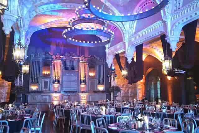 Ghillie Dhu auditorium with circular chandeliers and uplighting for wedding and corporate events.