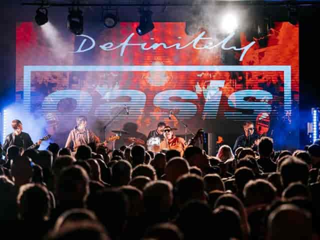 Live entertainment at The Liquid Room with LED branding and stage lighting for event activation.