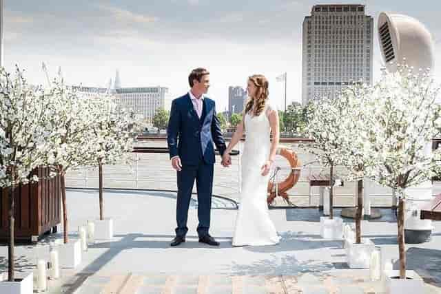 Golden Star boat deck with floral decor for luxury outdoor wedding and event venue rental.
