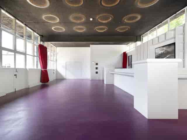 Harbinger Primary School ground floor hall with purple floor for event space or pop-up registration.