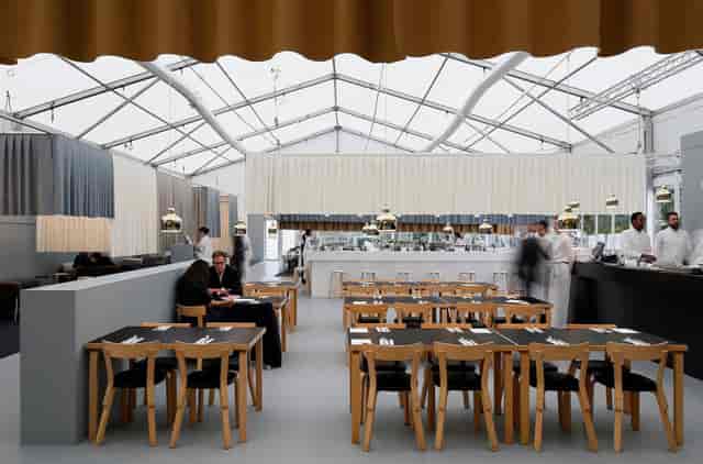 Minimalist pop-up dining structure with draped ceiling, ideal for luxury corporate events or galas.