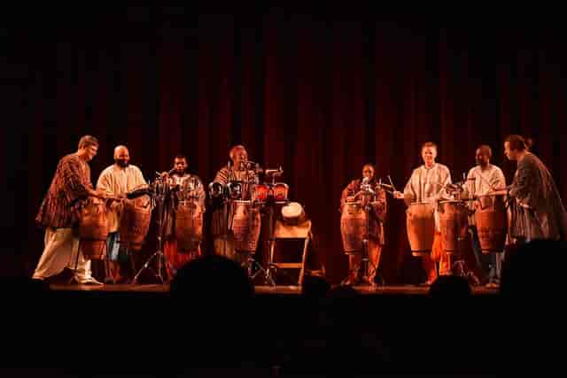 Percussion ensemble performing on Fellowship House Main Hall stage for corporate event entertainment.