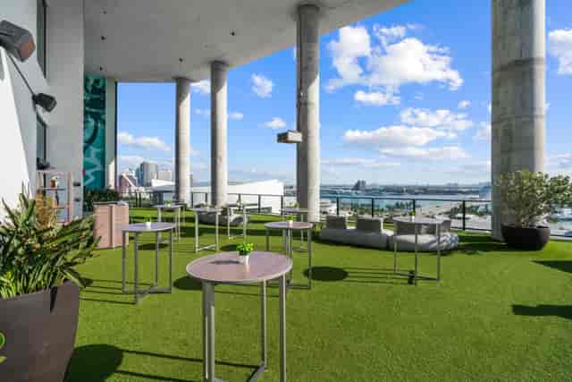 Outdoor wedding reception at The Elser Hotel with skyline views and cocktail lounge seating.
