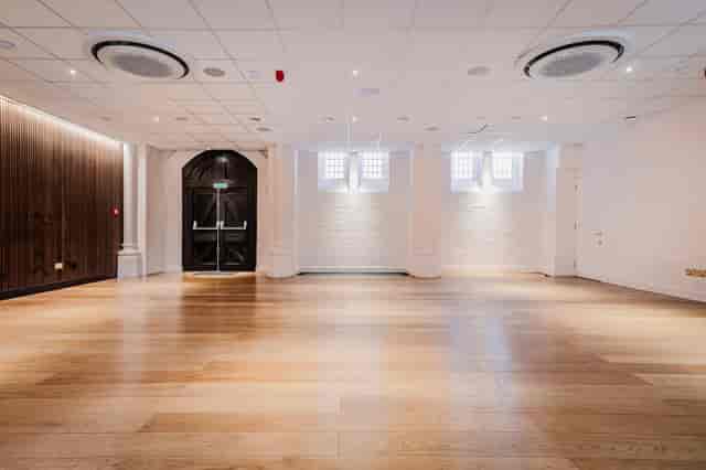 Meeting room with wood floors at Chalkhill Community Centre for workshops and receptions.