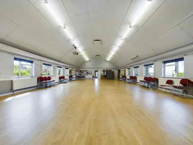 Large hall at Holy Innocents Church with vaulted ceilings, ideal for workshops and receptions.