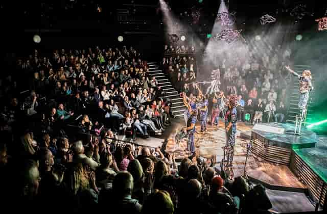 Tiered seating in Octagon Theatre Bolton auditorium for immersive theater events.