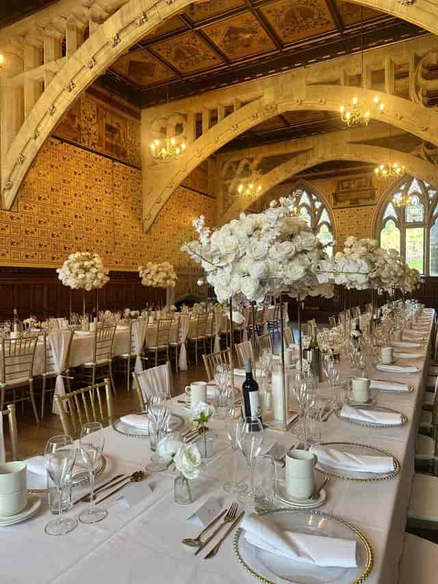 Rochdale Town Hall gala with tall floral centerpieces for elegant corporate event venue hire.